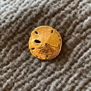 Gold starfish pendant.